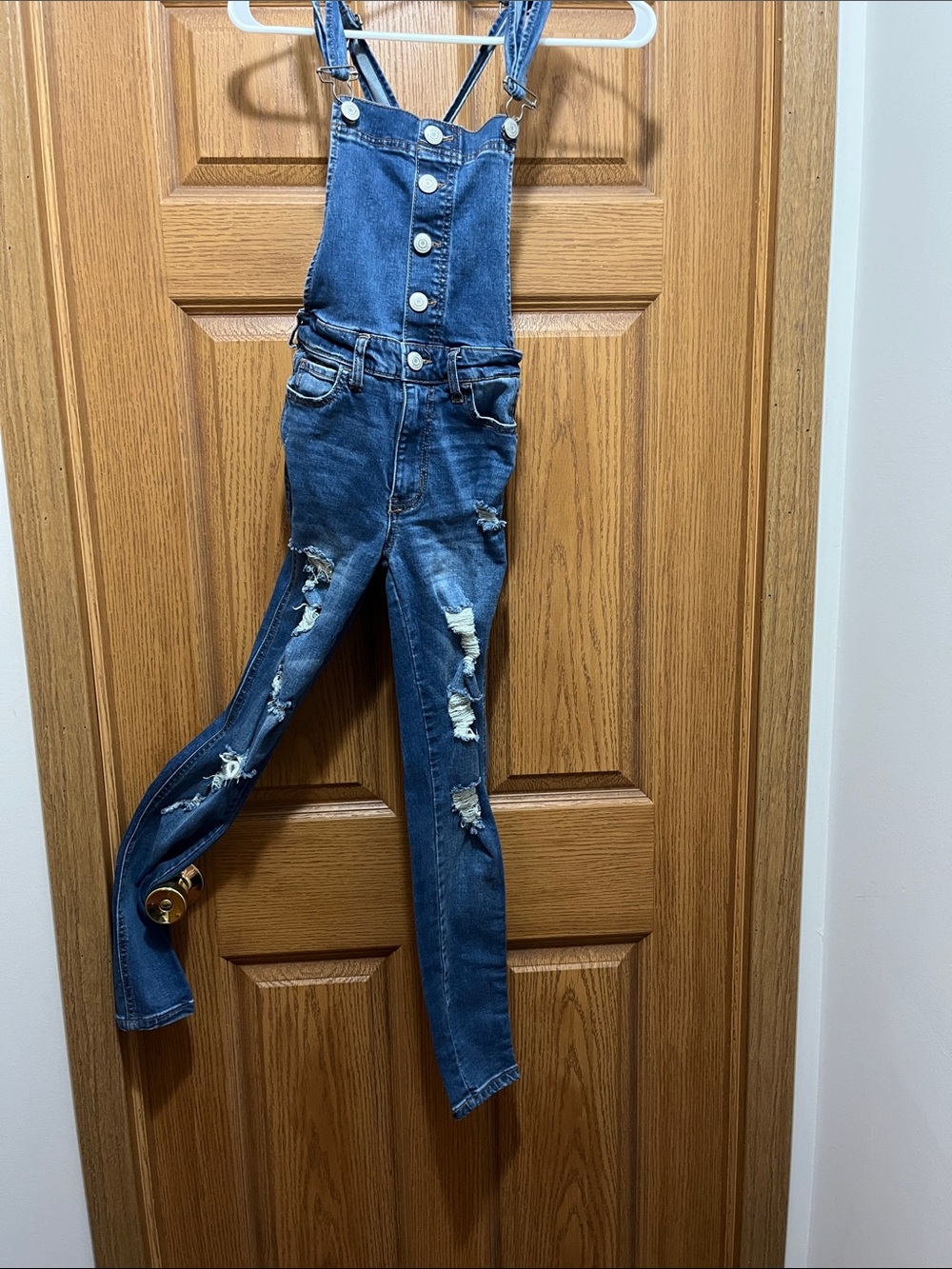 Ripped Denim Overalls in Dark Blue - Women's Jeans